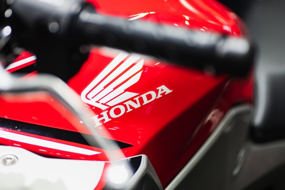 Bangkok, Thailand - Decemeber 5, 2019 : Honda  logo on the body of sports motorbike at a car show. Honda is a one of the famous manufacture of automobiles, motorcycles and power equipment.